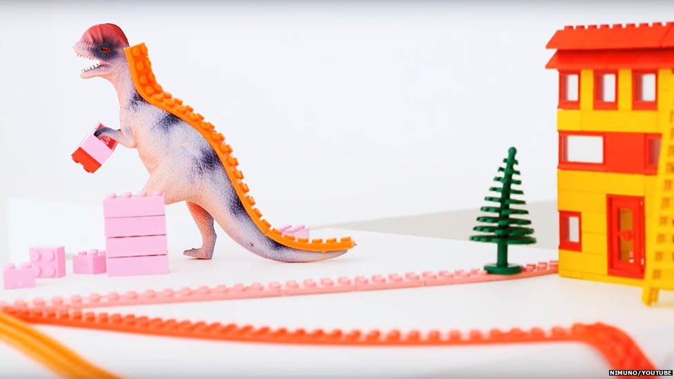 Lego tape stuck to back of dinosaur