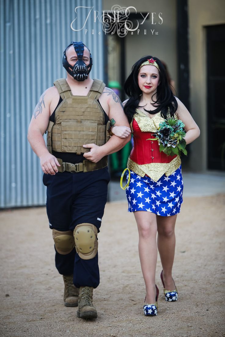 Wonder Woman bridesmaid walking with man dressed as Bane