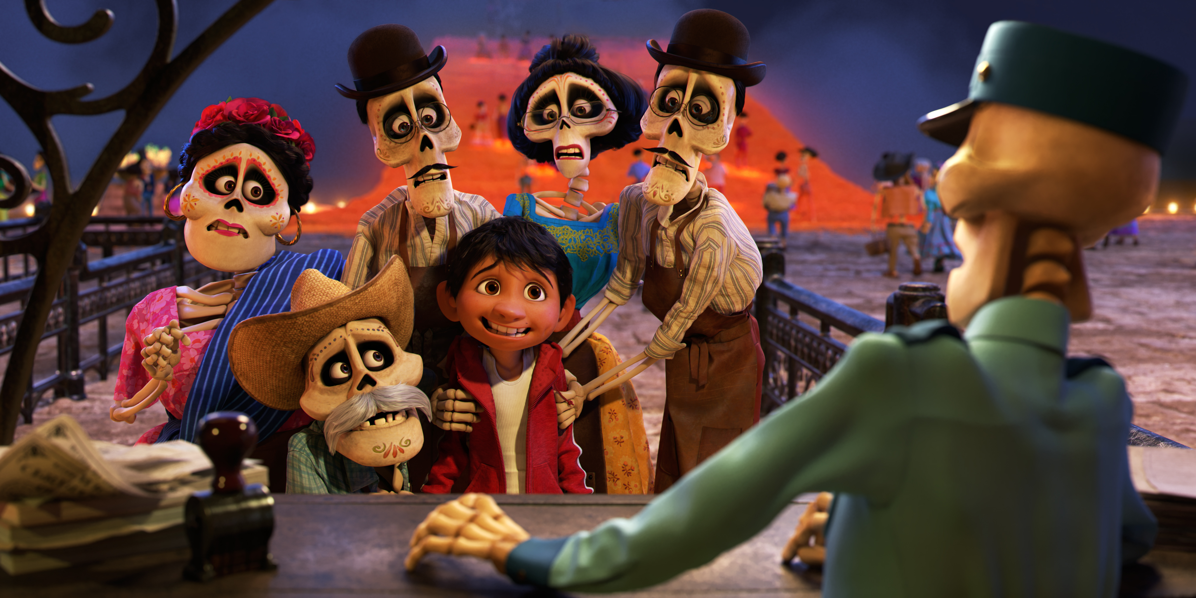 coco review - Miguel and skeletons looking nervous in pixar movie