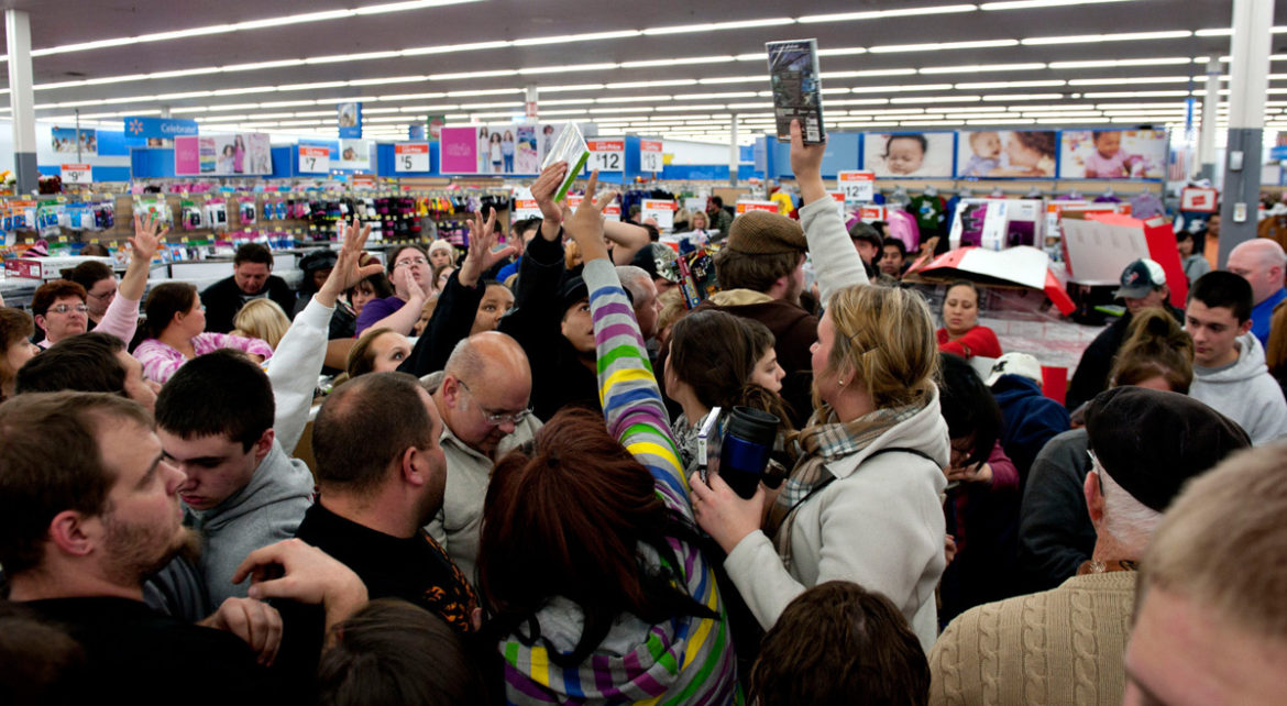 Customers reaching for items during Black Friday deals 2K17