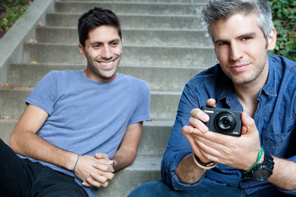 Host of Catfish: The TV Show Nev Schulman and Max Joseph sitting on stairs