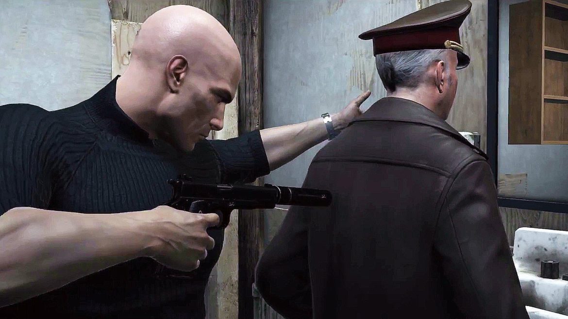 Agent 47 from Hitman 2 holding up a guard in Hitman(2016)