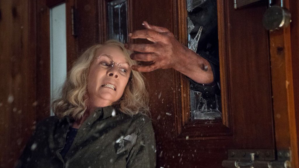 Jamie Lee Curtis as Laurie Stode being attacked in Halloween